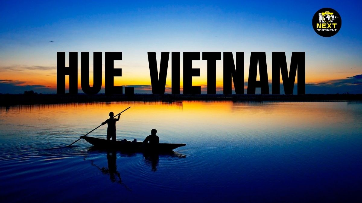 Hue Vietnam blog thumbnail with a scenic shot of Lang Co at dawn, a silhouette of a traditional boat and fisherman, with golden and blue reflections