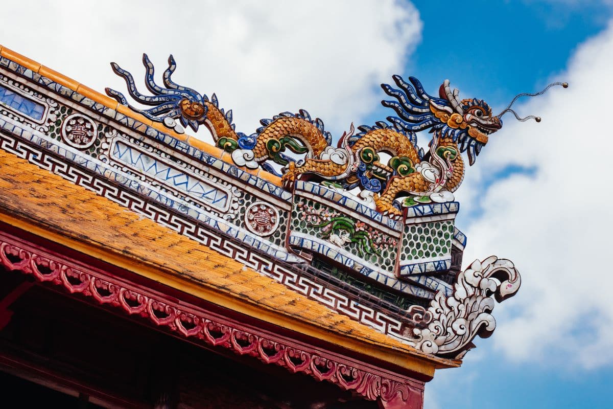 Close-up of a colorful dragon embellishment on the tiled roof of the Hue Imperial Citadel