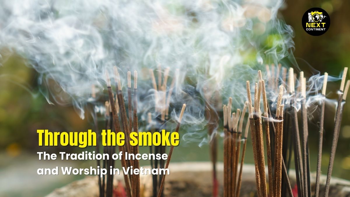 Blog thumbnail of incense sticks burning, releasing delicate trails of smoke against a blurred temple background, symbolizing spiritual connection and devotion in Vietnamese culture