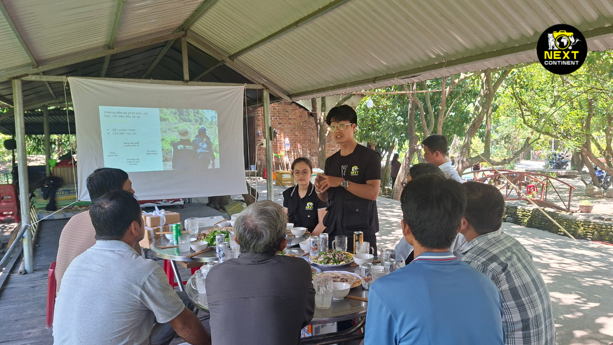 Next Continent wildlife guide leading an ecotourism training session with Tiên Phong Group members in Tam Mỹ, Vietnam.